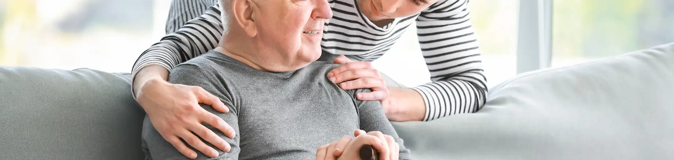 Caregiver talking with resident in a comfortable assisted living home near Pocatello Idaho