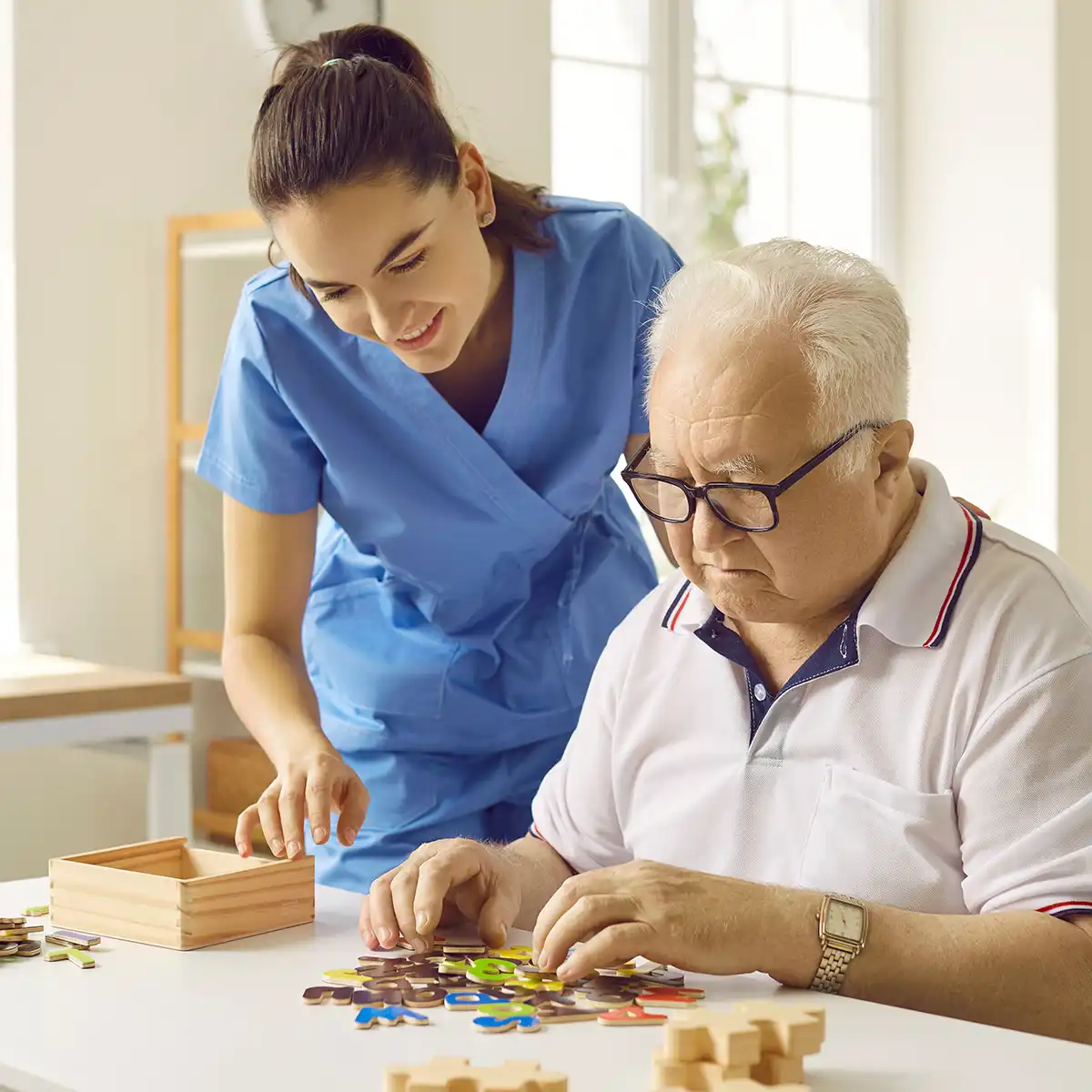 A caregiver providing compassionate support to an older adult
