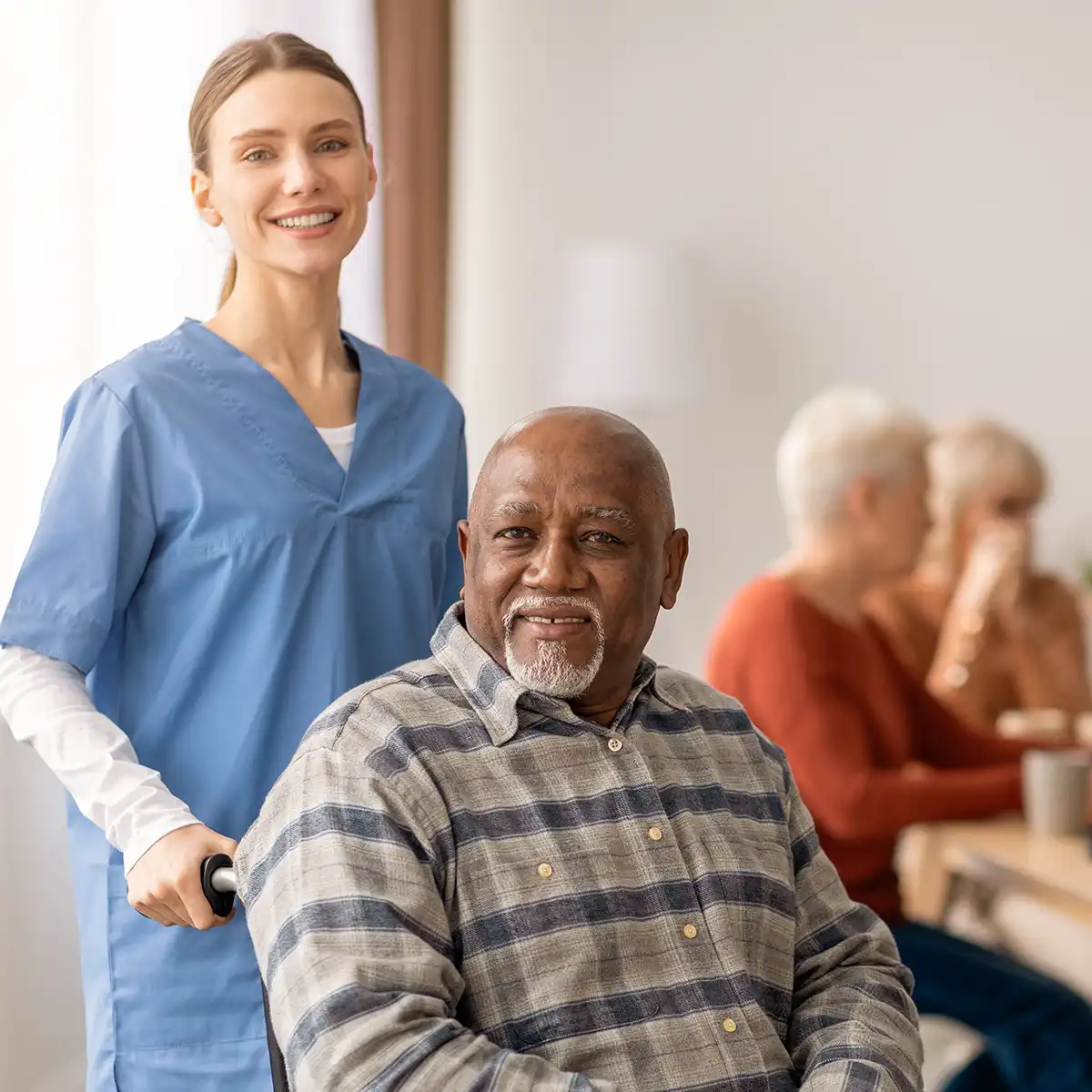 Family exploring senior living options together with a caregiver